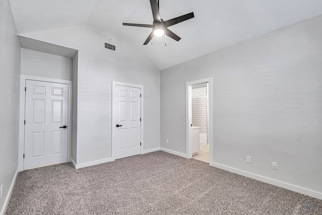 unfurnished bedroom with light colored carpet, ceiling fan, lofted ceiling, and ensuite bathroom