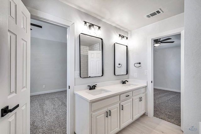 bathroom featuring vanity and ceiling fan