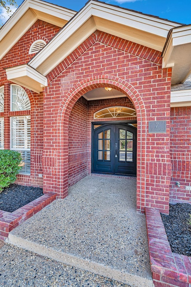 property entrance featuring french doors