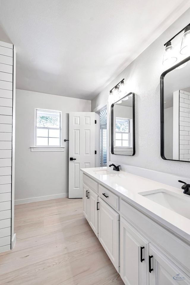 bathroom featuring vanity and hardwood / wood-style flooring