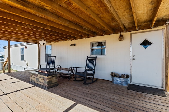 deck with a fire pit