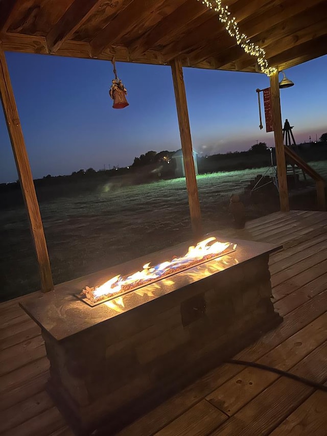 deck featuring an outdoor fire pit