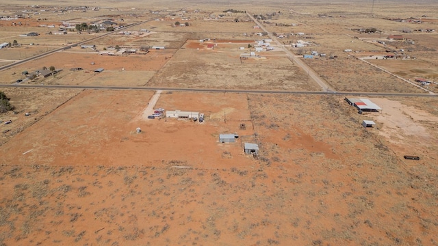 birds eye view of property with a desert view