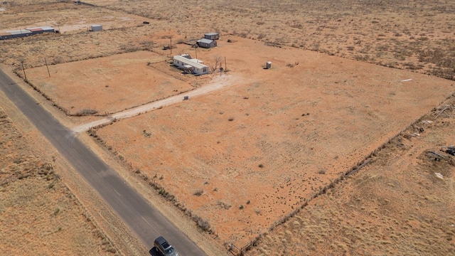 drone / aerial view with a rural view and view of desert