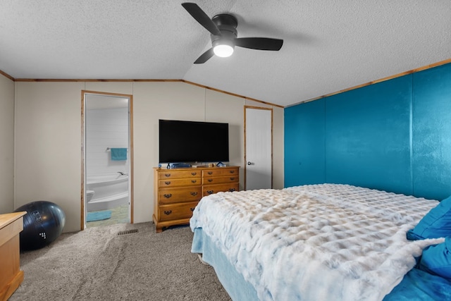 carpeted bedroom featuring lofted ceiling, a textured ceiling, ceiling fan, and ensuite bathroom