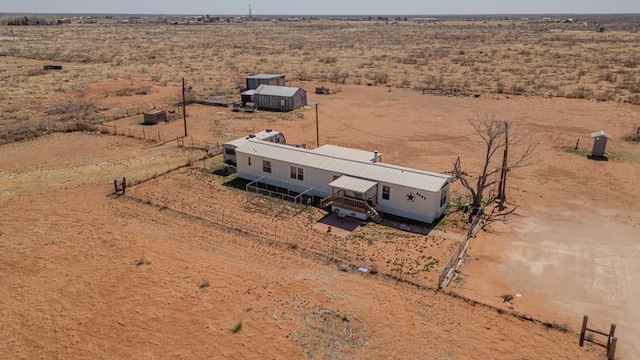 bird's eye view with a rural view and view of desert