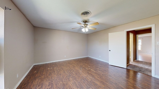 unfurnished room with dark hardwood / wood-style floors and ceiling fan