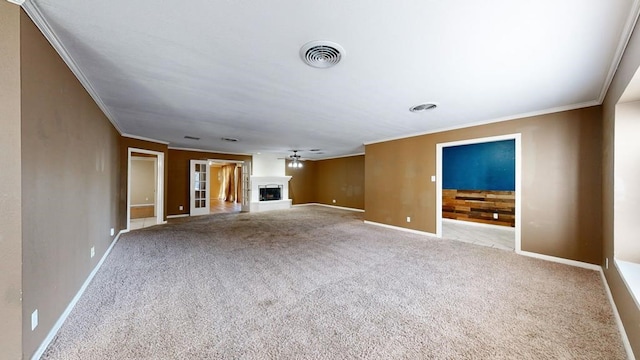 unfurnished living room with light carpet, ceiling fan, and crown molding