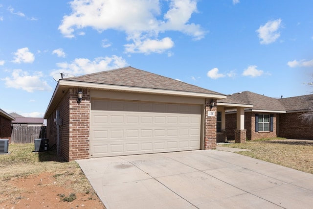 single story home with brick siding, an attached garage, fence, roof with shingles, and driveway