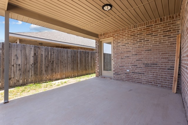 view of patio featuring fence