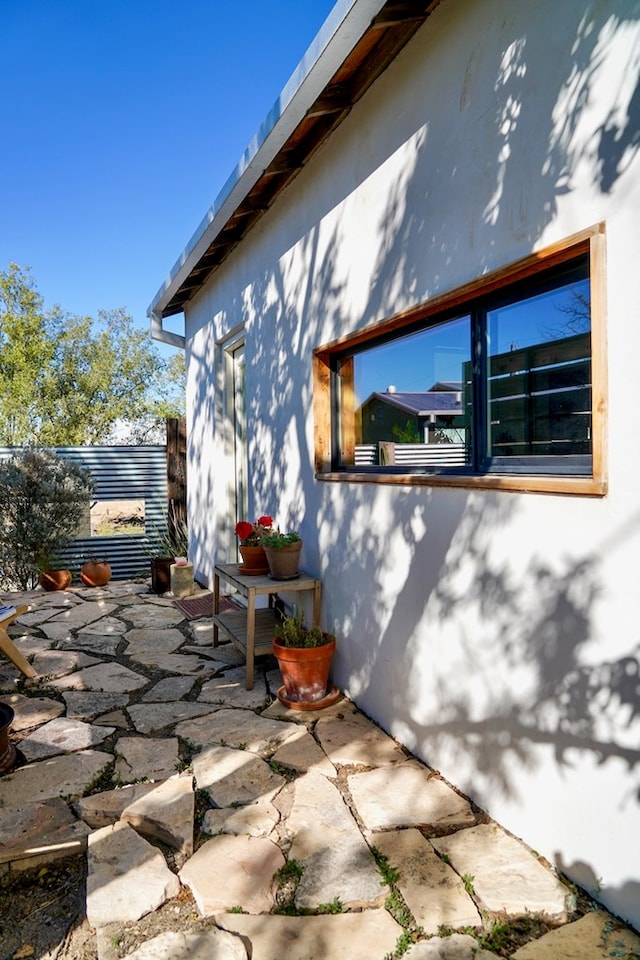 view of side of property with a patio