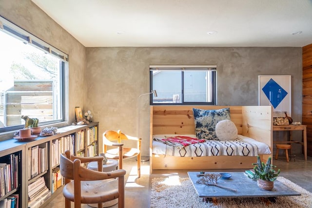 sitting room featuring concrete floors