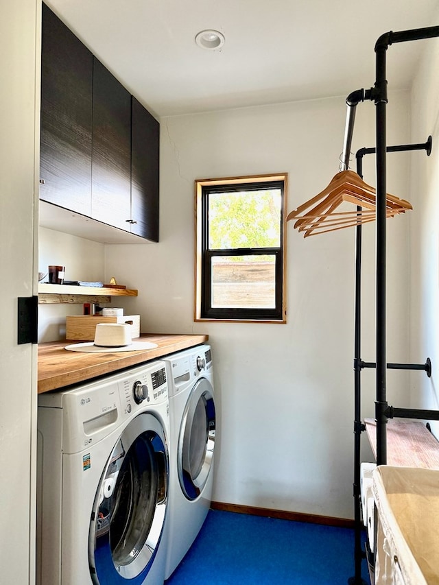 laundry room featuring dark colored carpet, cabinets, and independent washer and dryer