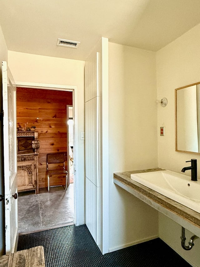 bathroom with tile patterned flooring and sink