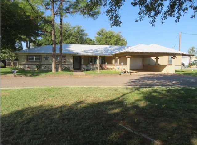 ranch-style house with a carport and a front yard