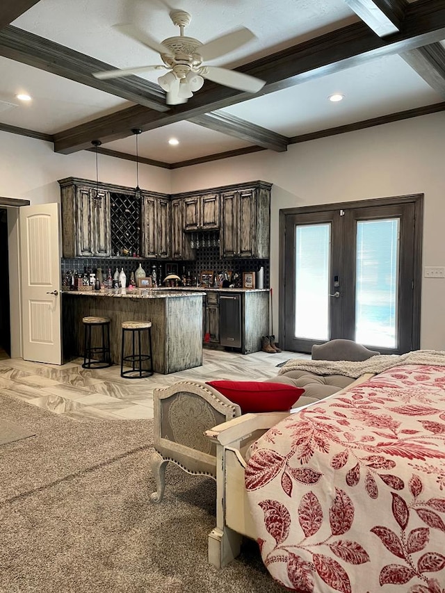 bedroom with beamed ceiling, light colored carpet, and ornamental molding