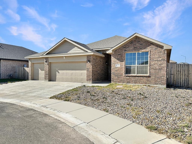 single story home featuring concrete driveway, an attached garage, fence, and brick siding