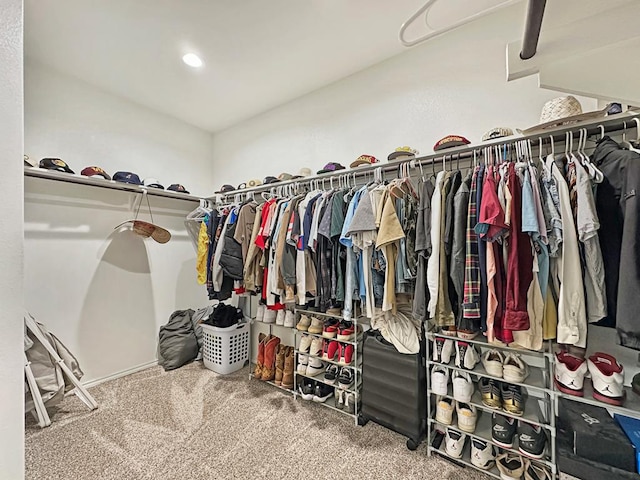 spacious closet with carpet flooring