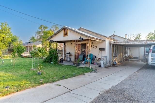 bungalow-style house featuring a front yard