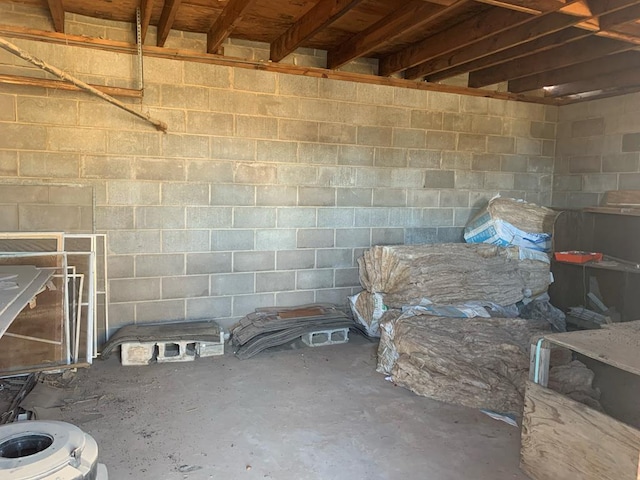 basement featuring concrete block wall