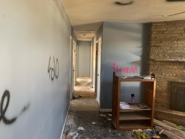 hallway featuring visible vents and a textured ceiling