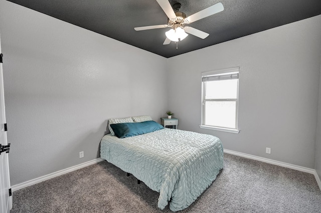 carpeted bedroom featuring a ceiling fan and baseboards