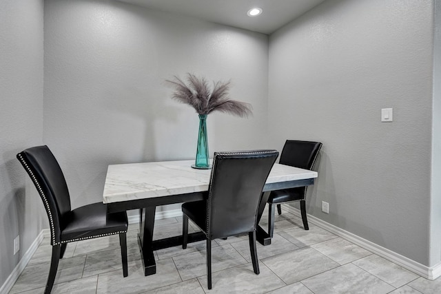 dining space with baseboards