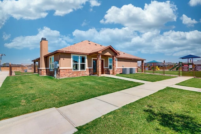 view of front of property with stucco siding, a chimney, a front lawn, and fence