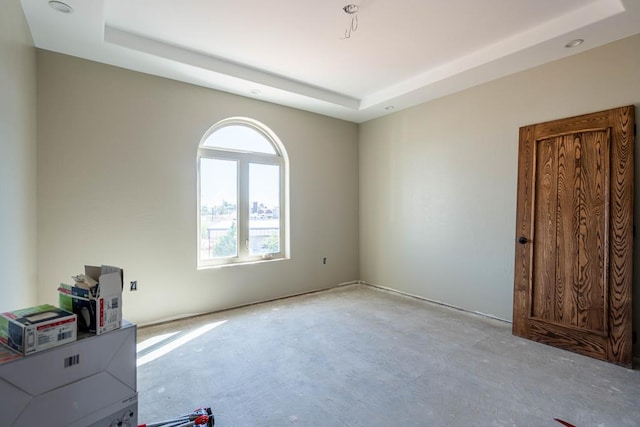 empty room with a raised ceiling