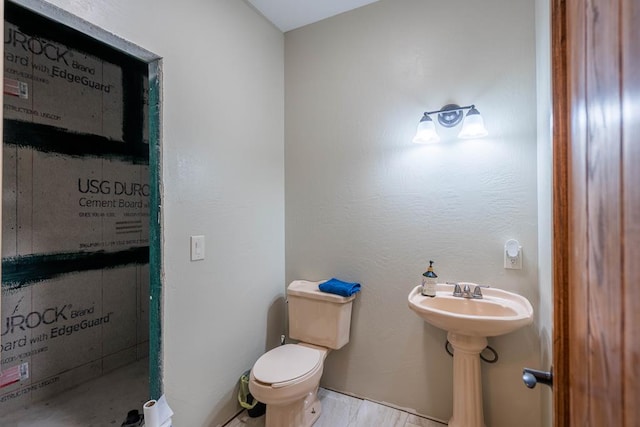 bathroom featuring tile patterned floors and toilet