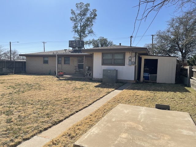 single story home featuring a patio area, a front lawn, a storage shed, and central air condition unit