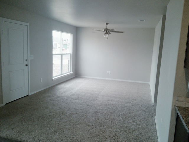 empty room with carpet and ceiling fan