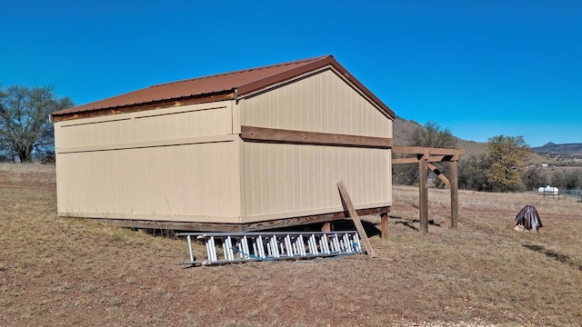 view of side of home with an outdoor structure