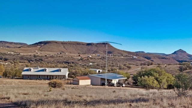 view of mountain feature with a rural view