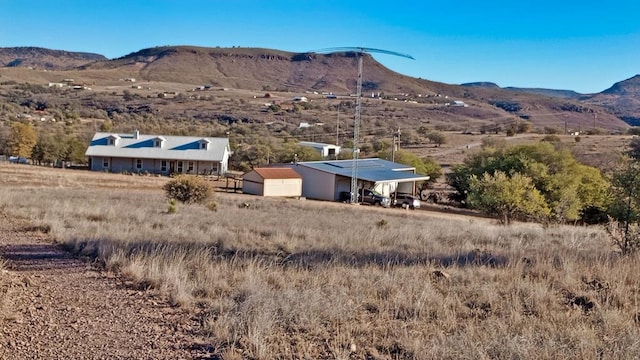 mountain view featuring a rural view