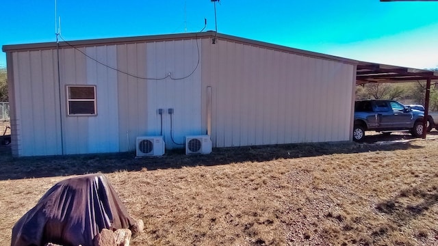 view of property exterior featuring ac unit and a carport