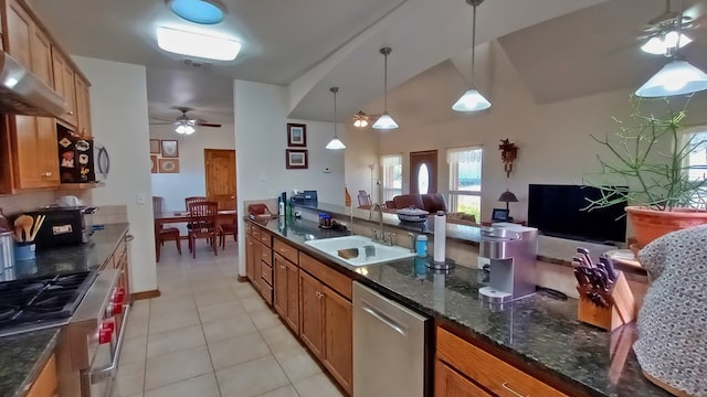 kitchen with ceiling fan, sink, stainless steel appliances, pendant lighting, and light tile patterned floors