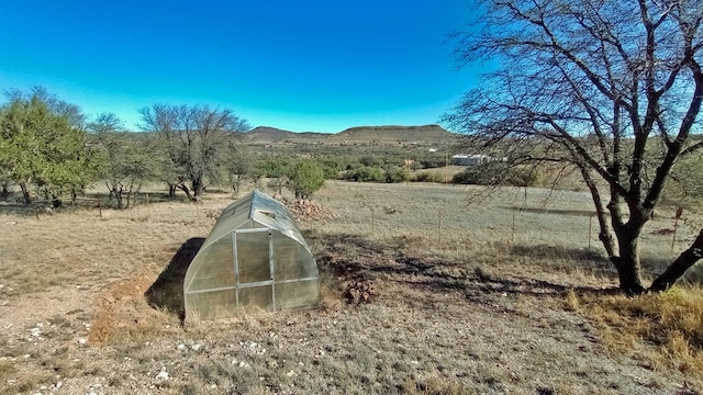 property view of mountains featuring a rural view