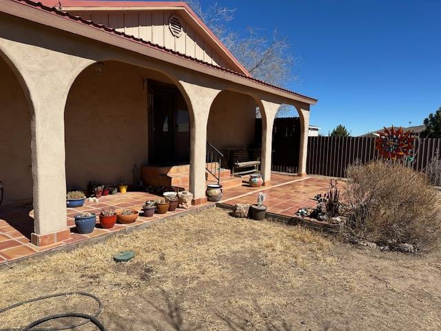 view of patio / terrace featuring fence