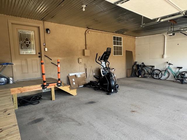 workout area with a garage