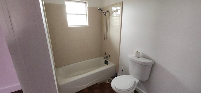 bathroom featuring toilet and tub / shower combination