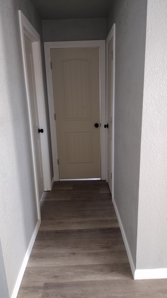 hallway featuring hardwood / wood-style flooring