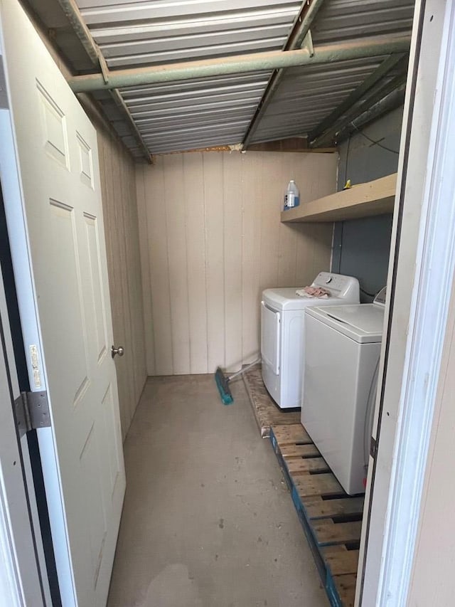 clothes washing area with separate washer and dryer