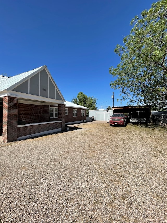 view of property exterior with a carport