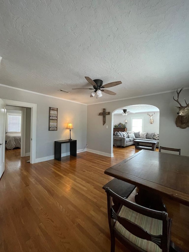 interior space featuring hardwood / wood-style flooring, ceiling fan, and a textured ceiling