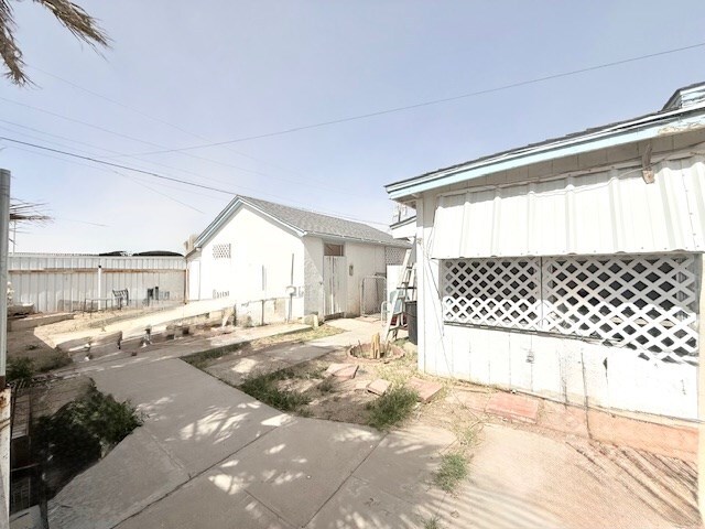 view of home's exterior featuring fence