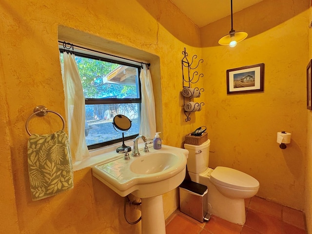 bathroom featuring tile patterned flooring and toilet