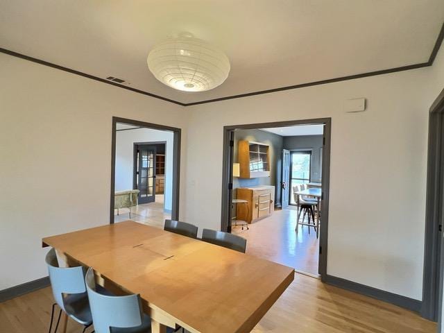 dining room with light hardwood / wood-style flooring