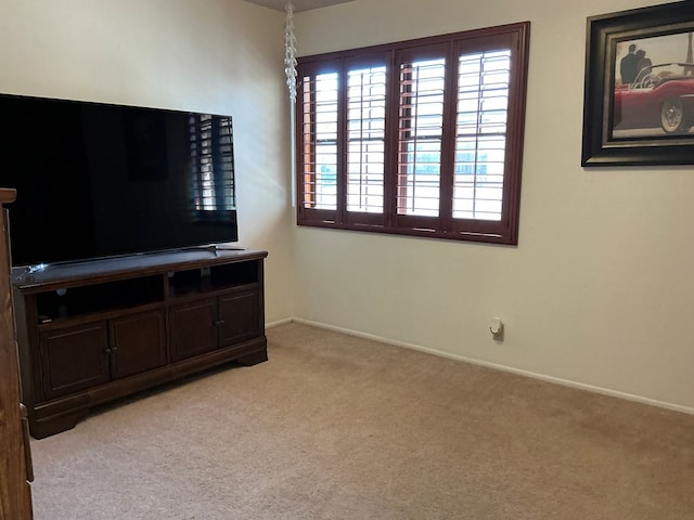 living room with light colored carpet and baseboards