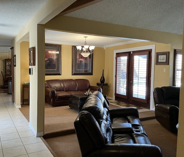 living room with crown molding, baseboards, light tile patterned flooring, a notable chandelier, and a textured ceiling